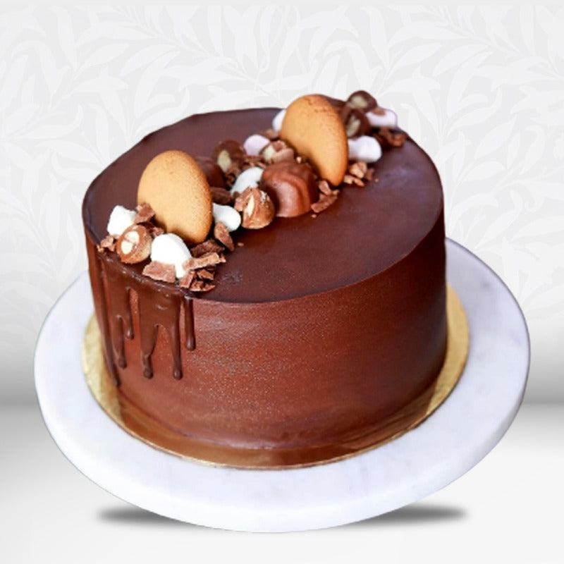 Delicious chocolate cake with nuts and cookies in Qatar