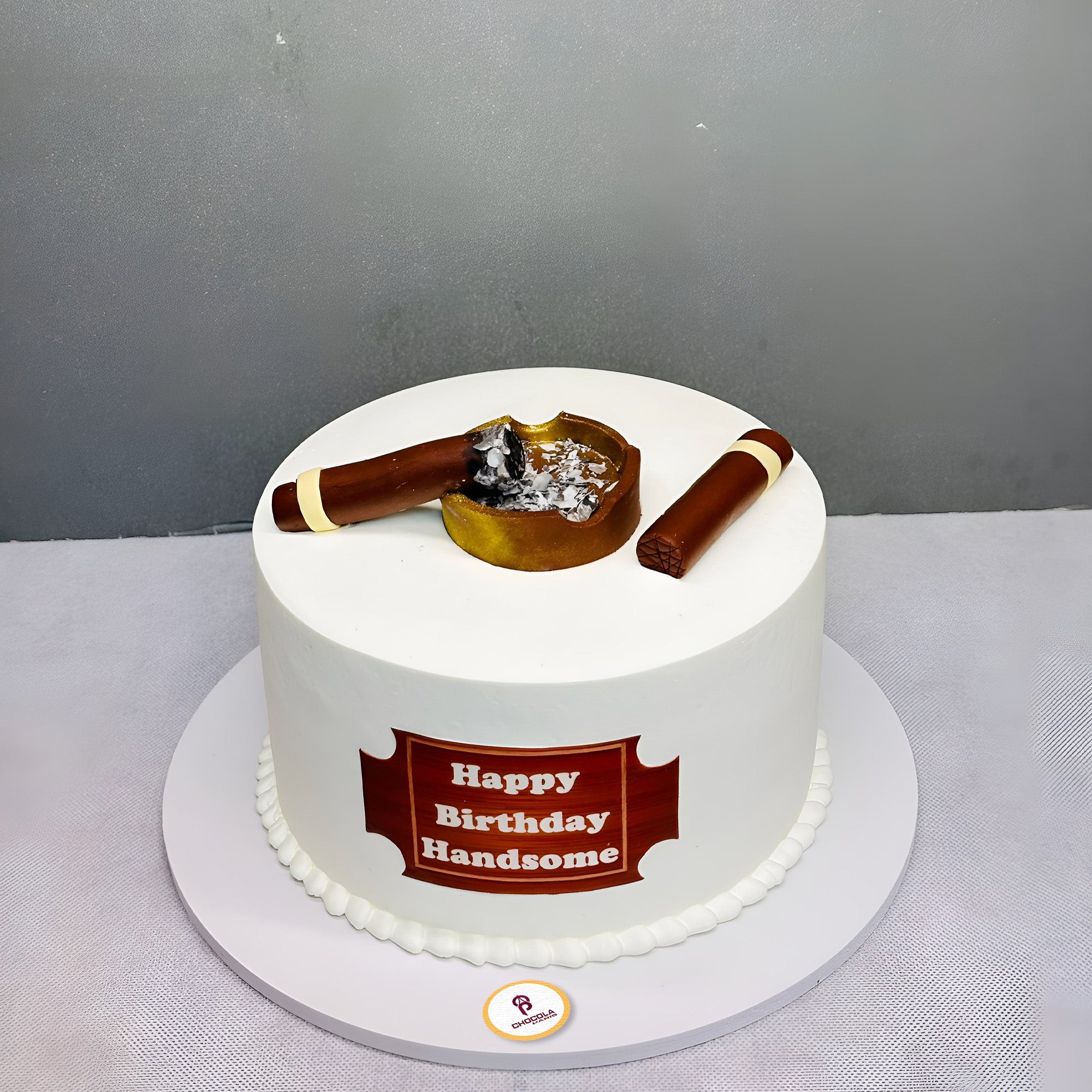 Cigar themed birthday cake