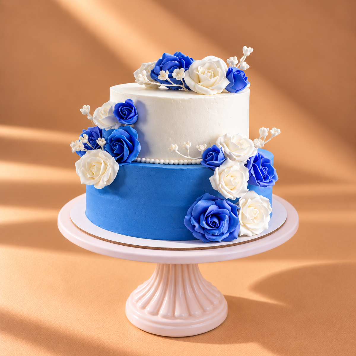 Beautiful Two Tier White and Blue Cake with Fresh Flowers