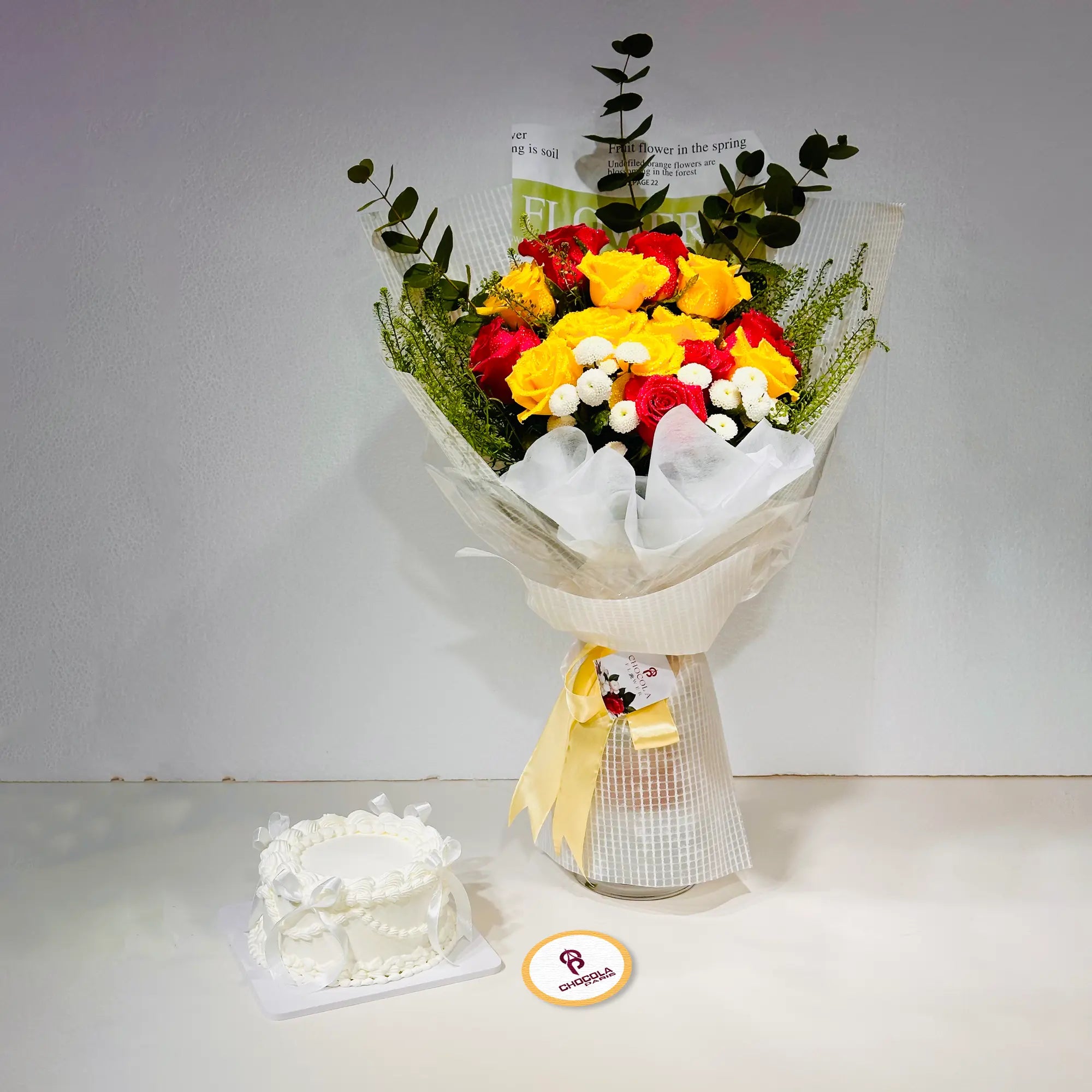 Colourful roses and white cake combo