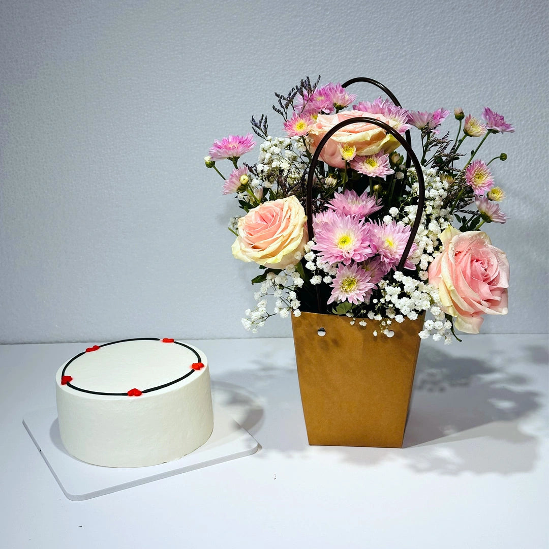 Pink blooms basket and white cake combo